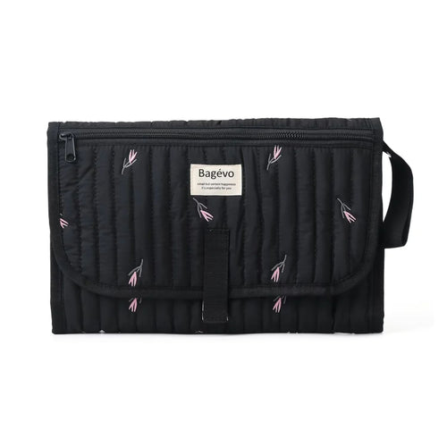 Quilted portable baby changing mat and travel clutch folded in minimalist floral Black tulip print - Available from Senso-Blanky