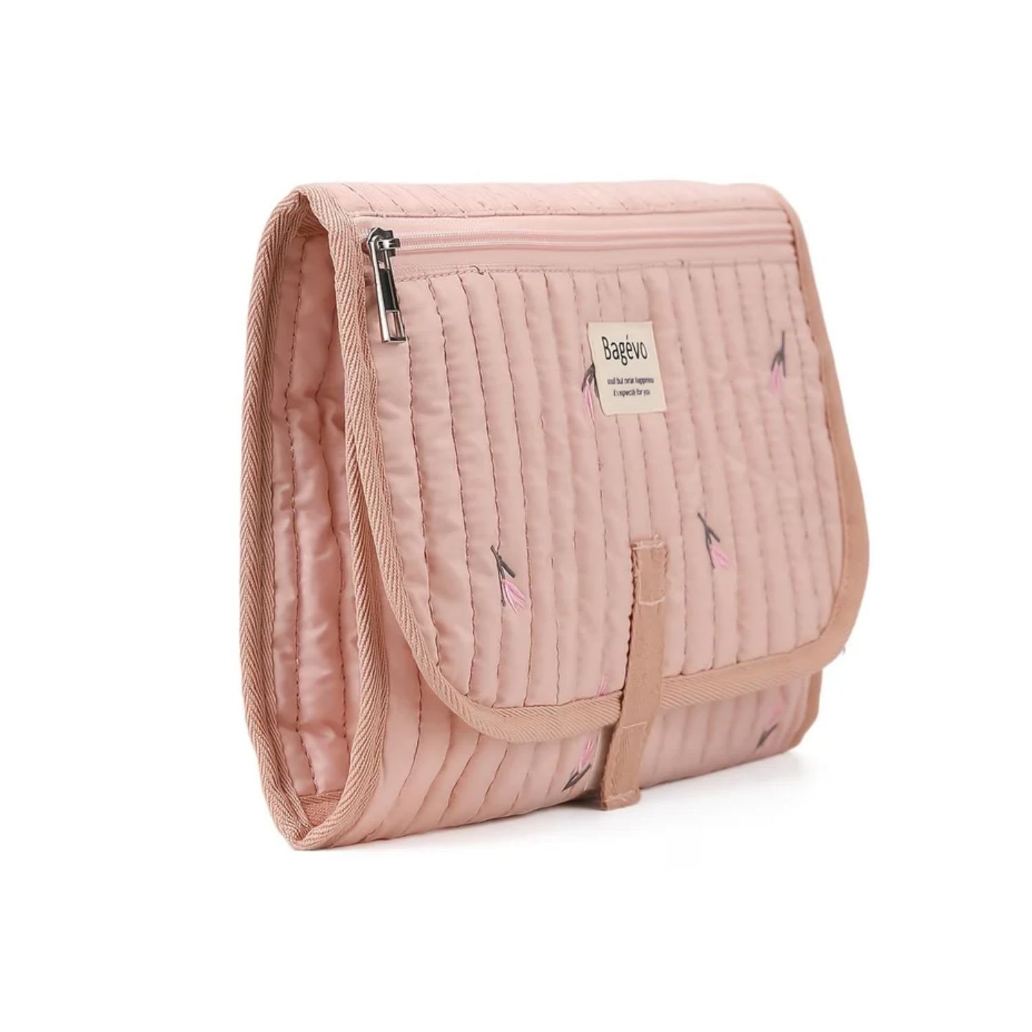 Side view of compact folded quilted baby changing clutch showing slim travel profile and storage caddy thickness - Pink Tulip available from Senso-Blanky
