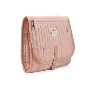Side view of compact folded quilted baby changing clutch showing slim travel profile and storage caddy thickness - Pink Tulip available from Senso-Blanky