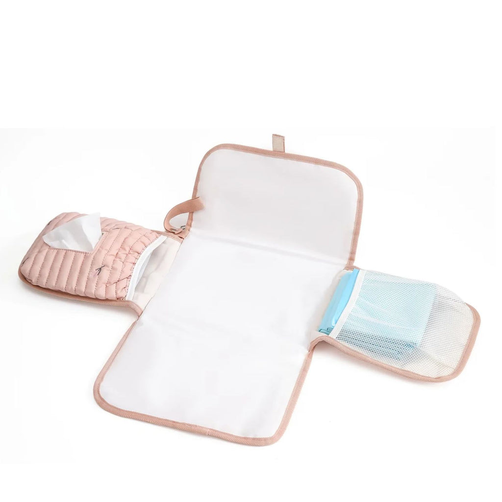 Quilted baby changing mat in Pink Tulip opened flat organized with diapers and baby wipes for travel available from Senso-Blanky