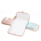 Quilted baby changing mat in Pink Tulip opened flat organized with diapers and baby wipes for travel available from Senso-Blanky