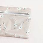 close-up of reusable waterproof wet bag set in dusty pink goose motif - available from Senso-Blanky