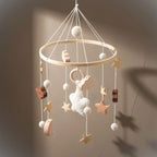 Baby_crib_Mobile_with_Gentle_Rattle_49x23cm_-_hung_dark_background_available_from_senso-blanky