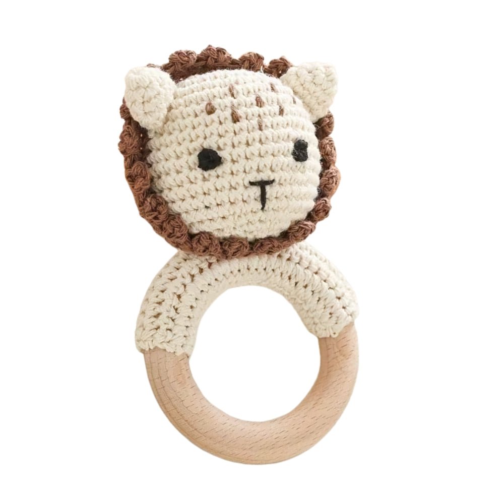 Premium hand-crochet lion baby rattle featuring a smooth, natural wood teething ring. Ideal for newborn sensory development, tactile stimulation, and grasping practice. Available from Senso-Blanky.
