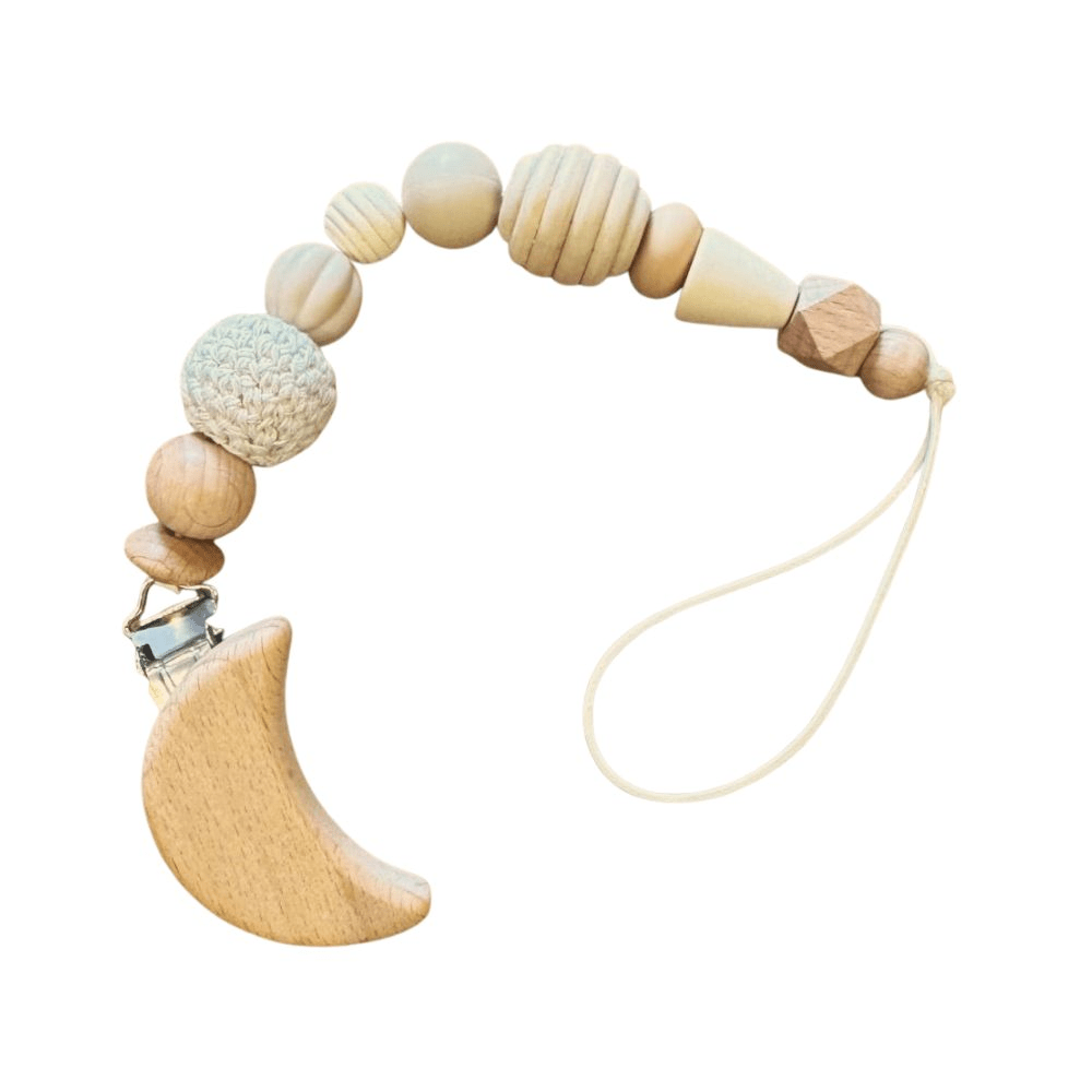 Handcrafted Moon wooden character dummy clip with premium food-grade silicone and natural beech wood sensory beads, attached to a pacifier. Designed in South Africa by Senso-Blanky.