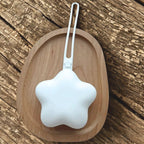 White star silicone dummy case  and wood surface available from Senso-Blanky
